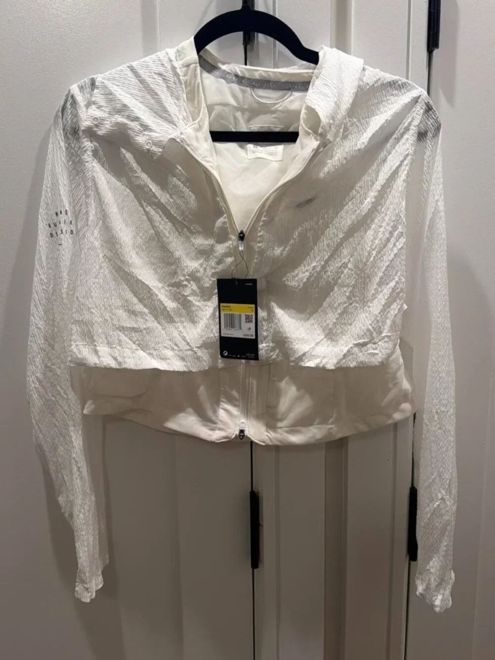 Nike white cover jacket with subtle textured pattern
